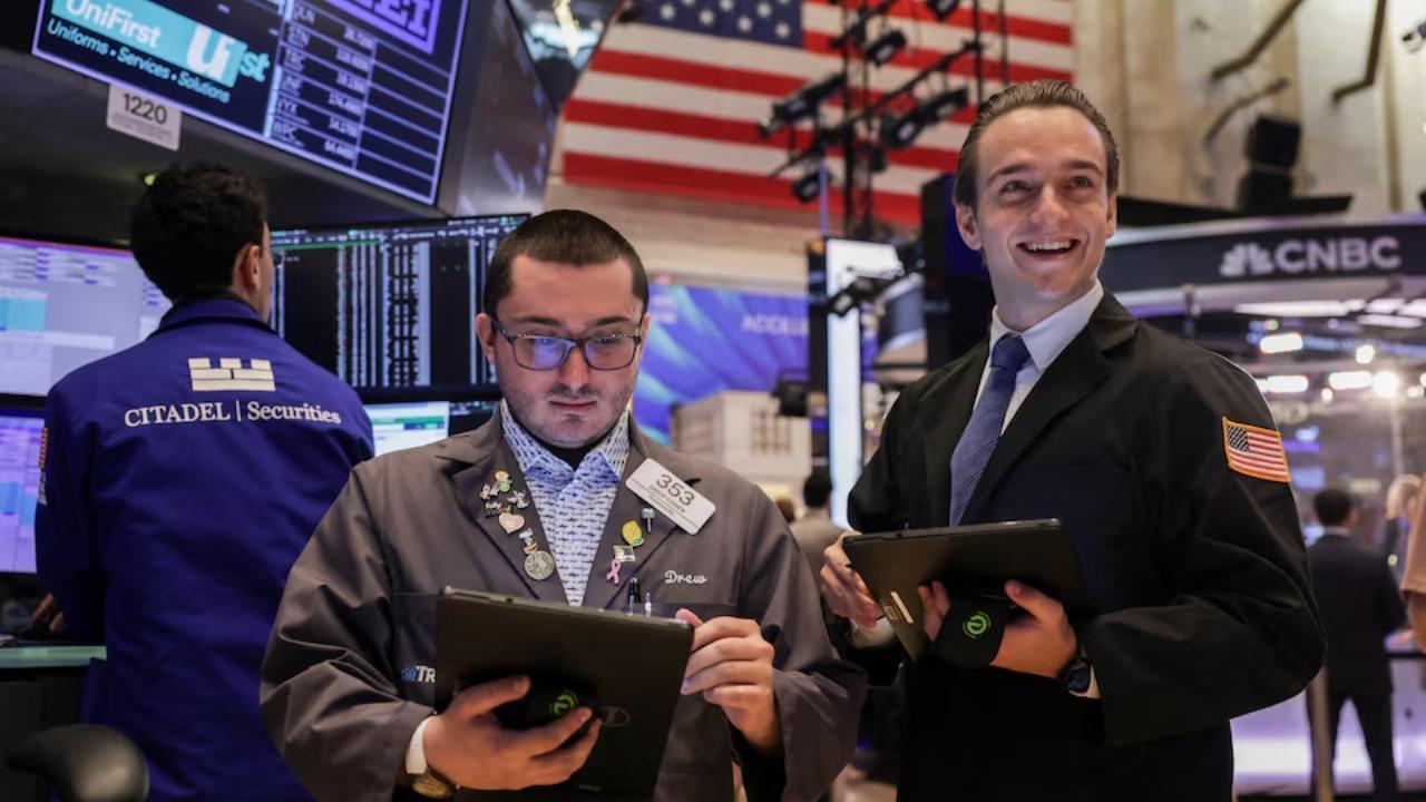 Wall Street lifted by tech profits, tariff fears linger