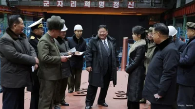 North Korea’s Kim Jong Un Oversees Submarine Construction and Missile Test