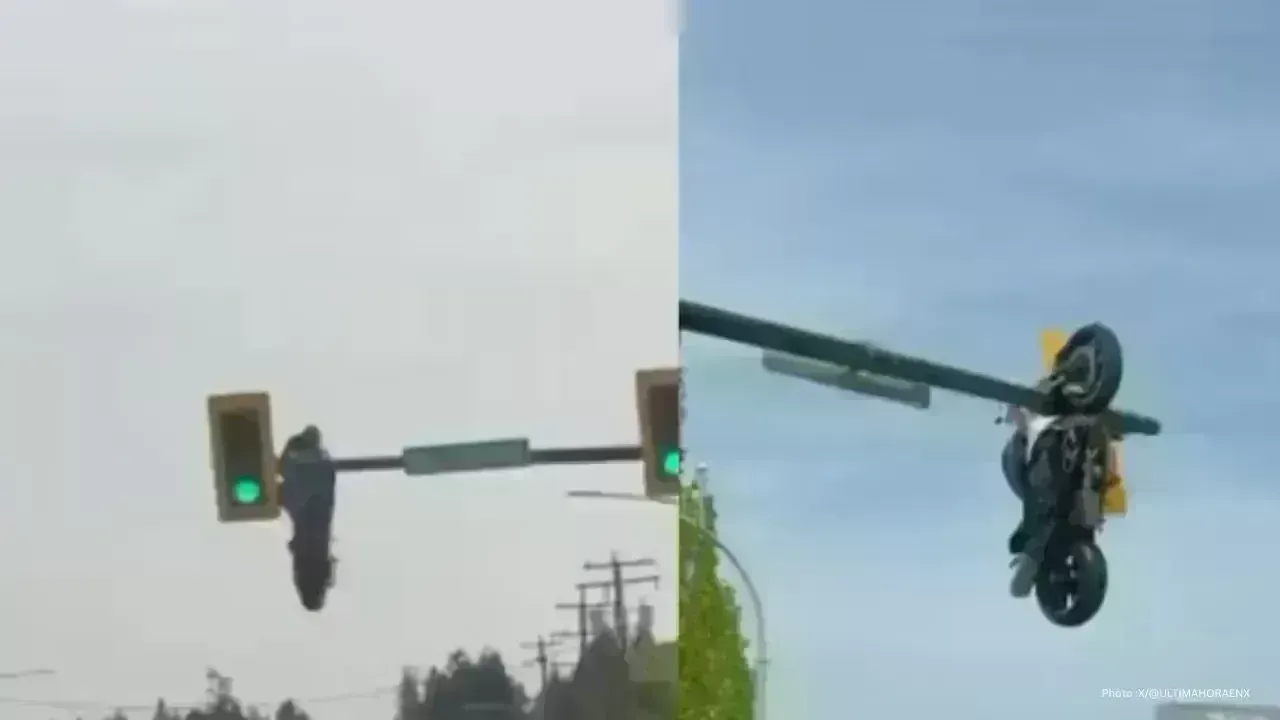 Motorcycle Accident Leaves Bike Dangling from Traffic Light in Canada